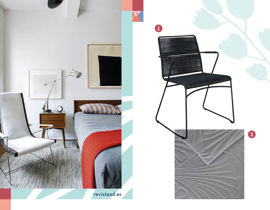 Dormitorio moderno con cama con cubrecama gris y una poltrona moderna