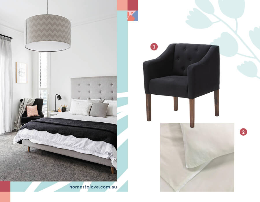 Dormitorio moderno con decoración en negro, blanco y gris. Poltrona negra con gran lámpara de techo