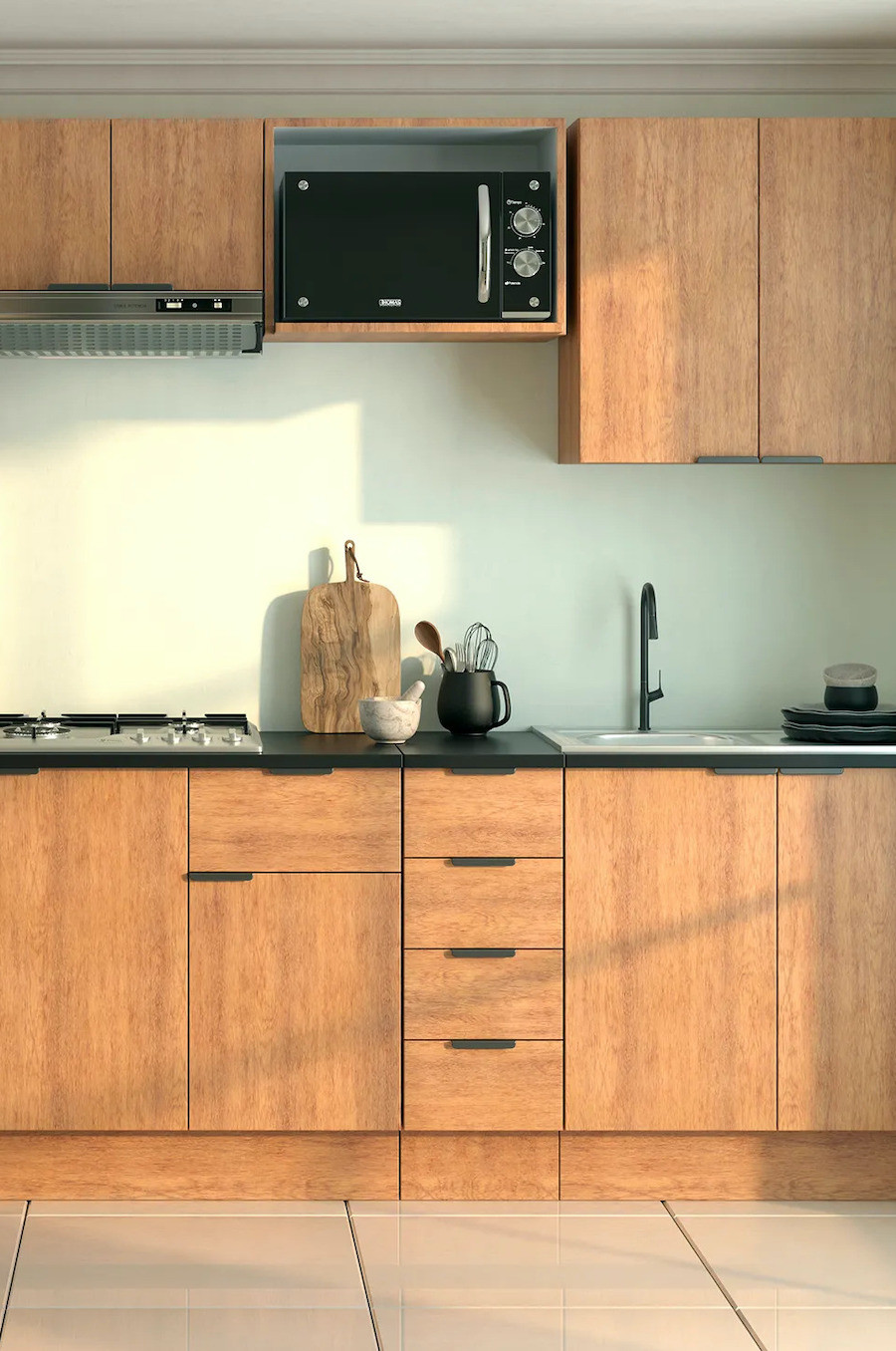 Cocina con muebles de madera, cubierta negra y pared verde claro.